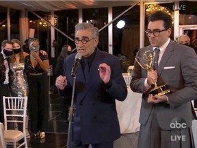In this video grab captured on Sept. 20, 2020, courtesy of the Academy of Television Arts & Sciences and ABC Entertainment, Annie Murphy, from left, Catherine O'Hara, Noah Reid, Sarah Levy, Karen Robinson, Eugene Levy and Daniel Levy accept the award for outstanding comedy series for "Schitt's Creek" during the 72nd Emmy Awards broadcast. (The Television Academy and ABC Entertainment