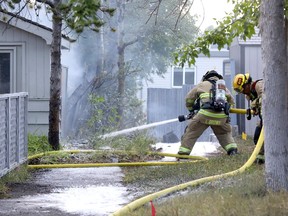 Calgary fire battle a house fire at St. Andrews Place N.W. in Calgary on Thursday, September 3, 2020.
