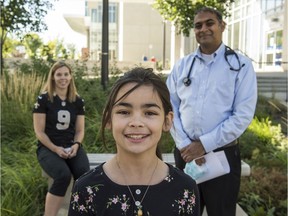 From left, Amanda Menjivar, Gabriela Menjivar , 9 and University of Alberta researcher, Dr. Piush Mandhane, who is leading a study looking at COVID-19 antibodies in children, Sept. 10, 2020.