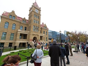 Calgarians gather to watch the official reopening of Calgary's Historic City Hall after its four year heritage rehabilitation on Tuesday, September 15, 2020.