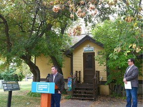 Alberta Premier Jason Kenney (L) and Parks Minister Jason Nixon are pictured at Fish Creek Park in front of the Friends of Fish Creek building in Calgary during a press conference on Tuesday, September 15, 2020.