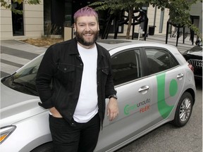 Blaine Horner is a Communauto beta tester in Calgary and is seen posting for a photo in front of the new ride sharing vehicle on 10th Ave. SW. Saturday, September 19, 2020.