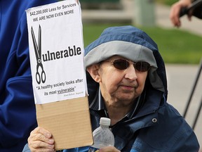 Client Baird Jarrett joined over 200 others during a protest outside Premier Alison Redford's office in an attempt to voice their concerns about the largest-ever planned cuts to supports to persons with developmental disabilities through the PDD program on May 31, 2013.