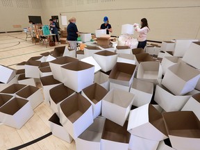 File photo: Volunteers pack care boxes at the Calgary Police Foundation YouthLink building on Wednesday, June 17, 2020.