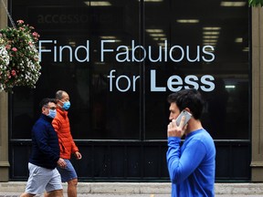 Calgarians walk in downtown Calgary on a cool day, Monday, Sept. 14, 2020.