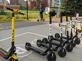 Calgarians ride e-scooters in Eau Claire on Wednesday, September 16, 2020. The City of Calgary is asking for online input as the shared e-scooter pilot program comes to an end.