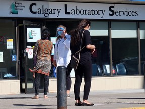 Calgarians wait to enter the Sunridge lab services location for medical testing on Thursday, September 24, 2020.
