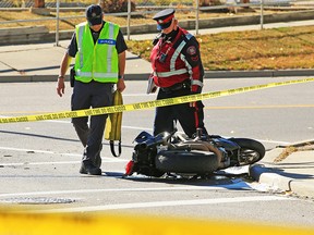 Police investigate a fatal collision between a car and a motorcycle at 17th Ave and 26th St. S.E. on Tuesday, Sept. 29, 2020. The motorcyclist died at the scene.