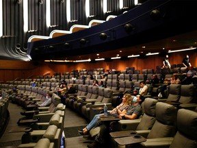 People take their seats inside the Odeon Luxe Leicester Square cinema, on the opening day of the film "Tenet", amid the coronavirus disease (COVID-19) outbreak, in London, Britain, August 26, 2020.