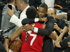 Toronto Raptors President Masai Ujiri embraces Kyle Lowry following Ujiri's encounter with a sheriff’s deputy while trying to get on the court after the Raptor's won the NBA championship, Jun 13, 2019.