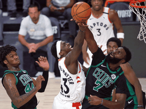 Boston Celtics guard Jaylen Brown blocks a shot by Toronto Raptors forward Pascal Siakam during game two of their NBA playoff series, Sep. 1, 2020.