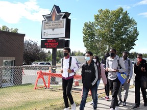 Students are seen outside St. Francis High School on Tuesday, Sept. 8, 2020.