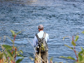 A man is seen fly-fishing along the banks of the Bow River as Calgarians enjoy the beginning of the Labour Day long weekend. Friday, September 4, 2020.