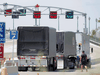 Trucks prepare to cross The Peace Bridge, which runs between Canada and the United States, over the Niagara River in Buffalo, New York, July 15, 2020. Increased purchasing by consumers has brought cross-border trucking back to near normal levels.