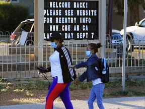 Students at Stanley Jones School head back to classes.