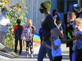 Students at Mayland Heights School gather before the bell on Tuesday, Sept. 1, 2020. It was the first day for Calgary Board of Education students starting back amidst the COVID-19 pandemic.