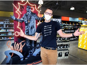 Calgary artist Tyler Lemermeyer stands in front of his one-of-a-kind, 7-foot tall sculpture of the world-renowned entertainer Snoop Dogg at the Liquor Depot in Brentwood. Lemermeyer created the sculpture to help launch a new wine from Australian winery, 19 Crimes, called Cali Red   Friday, September 4, 2020. Dean Pilling/Postmedia