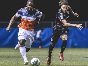 Cavalry FC’s Mohamed Farsi competes for a ball against  Forge FC’s Dominic Samuel on Aug. 13, 2020 during the opening game of the Canadian Premier League Island Games in Charlottetown, P.E.I. The match ended in a 2-2 draw. Canadian Premier League/Chant Photography