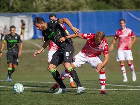 Canadian Premier League - York9 FC  vs Cavalry FC - Charlottetown, PEI- Sept 5, 2020]. Cavalry FC #17 Nico Pasquotti looks to get the ball from York9 FC.