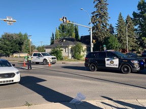 Police direct traffic at the scene where two children were struck in a marked crosswalk at the intersection of 25 Street and 17th Avenue SW on Wednesday morning.