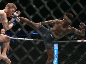 Hakeem Dawodu (right) fights Austin Arnett during UFC Fight Night at the Saddledome in Calgary on July 28, 2018. Dawodu won by unanimous decision.Jim Wells/Postmedia