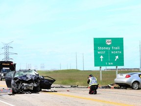 Calgary Police investigate at the scene of an two vehicle accident at 104 St SE and Hwy 22x on the south edge of Calgary city limits. Saturday, July 13, 2019. Jim Wells/Postmedia