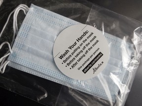 A package of non-medical masks provided by the Government of Alberta and distributed at restaurant drive-thru locations across the province.