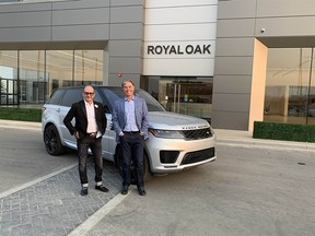 Vaughan Wyant (L) of Wyant Group and Paul Valentine of Valentine Group outside the new showroom with a Range Rover.