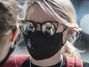 A woman wearing a mask in downtown Toronto on Friday, Sept. 11, 2020.