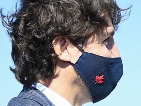 Canadian Prime Minister Justin Trudeau wear his mask as he takes part in a ground breaking event at the Iamgold Cote Gold mining site in Gogama, Ont., on Friday, September 11, 2020.