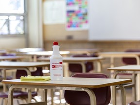 A bottle of sanitizer sits on a desk in a classroom in Henry Wise Wood High School in Calgary, prior to the school reopening.