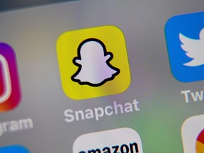 Logo of the mobile app Snapchat is displayed on a tablet.