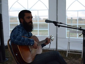 Michael Bernard Fitzgerald plays in the Greenbriar tent on a farm outside of Fort MacLeod for the Pincher Creek stop of his Farm Tour on Thursday, Sept. 3. Photo by Riley Cassidy