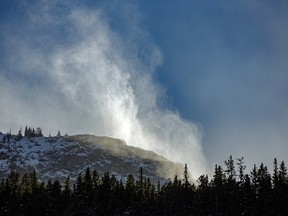 Snow blows off the peaks above the Kananaskis River west of Calgary, Alta., on Tuesday, October 20, 2020.