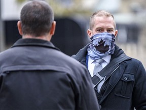 Const. Alexander Dunn, the police officer charged with assault for slamming Dalia Kafi to the floor, walks out of Calgary Courts Centre on Wednesday, October 28, 2020.