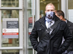 Const. Alexander Dunn, the police officer convicted of assault for slamming Dalia Kafi to the floor, walks out of Calgary Courts Centre on Wednesday, Oct. 28, 2020.