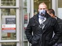 Const.  Alexander Dunn, the police officer charged with assault for knocking Dalia Kafi to the ground, walks out of Calgary Courts Center on Wednesday, October 28, 2020.