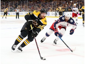 BOSTON, MASSACHUSETTS - MAY 04: Joakim Nordstrom #20 of the Boston Bruins skates against Nick Foligno #71 of the Columbus Blue Jackets during the first period of Game Five of the Eastern Conference Second Round during the 2019 NHL Stanley Cup Playoffs at TD Garden on May 04, 2019 in Boston, Massachusetts.