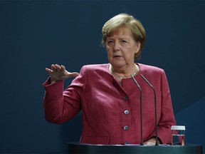 BERLIN, GERMANY - OCTOBER 09: German Chancellor Angela Merkel gives a statement on rising coronavirus cases in German cities on October 9, 2020 in Berlin, Germany.