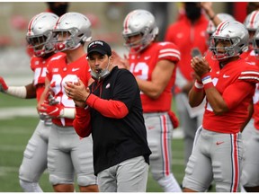 COLUMBUS, OH - OCTOBER 24:  Head coach Ryan Day of the Ohio State Buckeyes and his team warm up before their game against the Nebraska Cornhuskers at Ohio Stadium on October 24, 2020 in Columbus, Ohio.