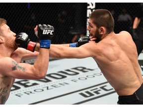 ABU DHABI, UNITED ARAB EMIRATES - OCTOBER 25: In this handout image provided by UFC, (R-L) Khabib Nurmagomedov of Russia punches Justin Gaethje in their lightweight title bout during the UFC 254 event on October 25, 2020 on UFC Fight Island, Abu Dhabi, United Arab Emirates.