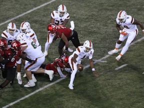 D’ Eriq King of the Miami Hurricanes runs the ball against the Louisville Cardinals at Cardinal Stadium on September 19, 2020 in Louisville, Ky. Andy Lyons/Getty Images