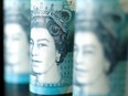 British five pound banknotes are seen in this picture illustration taken November 14, 2017.