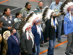 Premier Jason Kenney participates in the grand entry as Alberta's government and four First Nations signed an historic agreement to build a brighter future for members of the Stoney Nakoda-Tsuut'ina Tribal Council near Calgary on Friday, October 2, 2020. Jim Wells/Postmedia