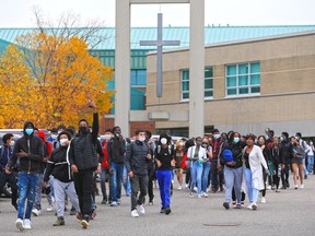 Bishop McNally High School students stage a walkout after recent racial incidents on Thursday, October 8, 2020.