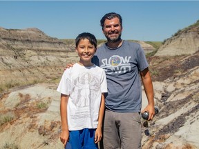 Nathan Hrushkin, 12, and his father, Dion, discovered partially exposed bones while hiking in Horseshoe Canyon near Drumheller. The bones belonged to a young hadrosaur, commonly known as a duck-billed dinosaur. Courtesy Nature Conservancy of Canada.