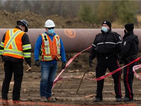 Edmonton Police Service officers were on scene of a workplace incident involving a crane at a Trans Mountain pipeline worksite at Winterburn Road and Whitemud Drive on Tuesday, Oct. 27, 2020.