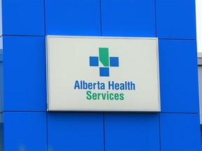 The Alberta Health Services logo is seen on the Southgate EMS Centre on Tuesday, October 13, 2020. The Alberta government is looking to cut about 11,000 Alberta Health Services jobs to save $600 million over three years.