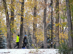 Calgary runners enjoy a frosty run through the lingering fall colours on Prince’s Island in Calgary, Monday, October 19, 2020.