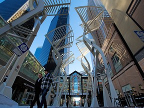 Pedestrians walk on Stephen Avenue Mall in downtown Calgary on Oct. 20, 2020.